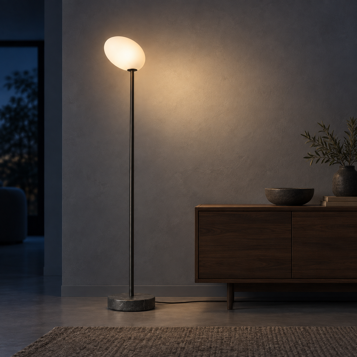 Obsidian Stem Floor Lamp casting light on a mineral wall